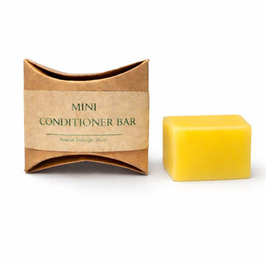 Yellow mini conditioner bar with brown packaging on a white background